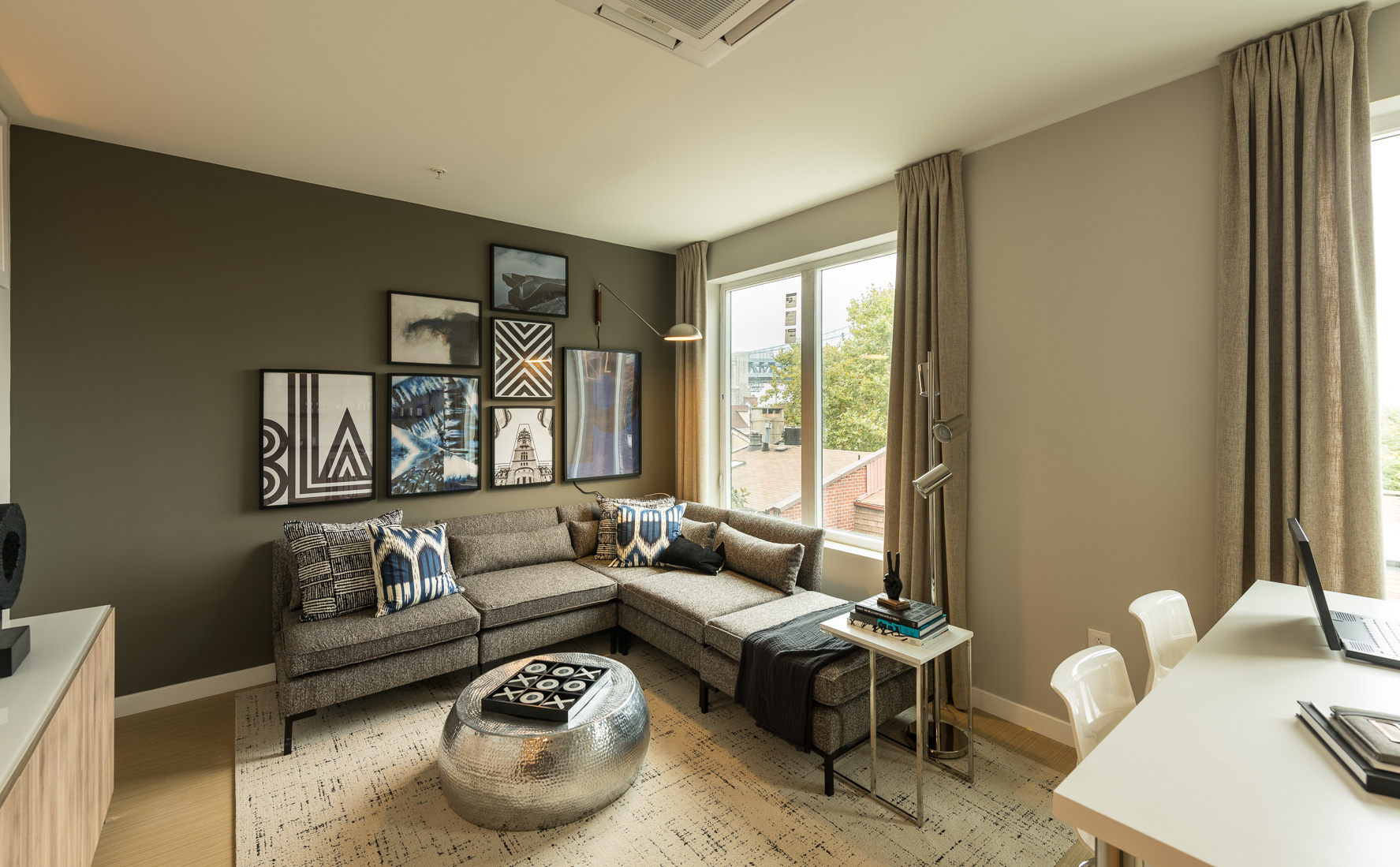 Open concept living room with hardwood floors and wonderful view of city in Old City apartment rentals