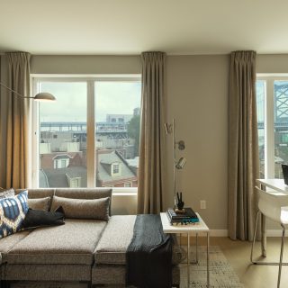 Splendid The National living room with hardwood flooring and luxurious features in Old City apartment rentals