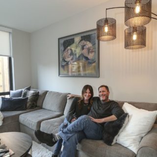 Couple inside apartment home at The National in Old City